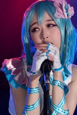 Japanese cosplayer Ria Kurumi sings on music stage while getting fucked from behind