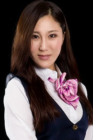 Flight attendant Yuu Kazuki posing in uniform, getting teased by a vibrator