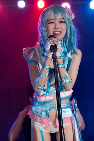 Japanese cosplayer Ria Kurumi sings on music stage while getting fucked from behind
